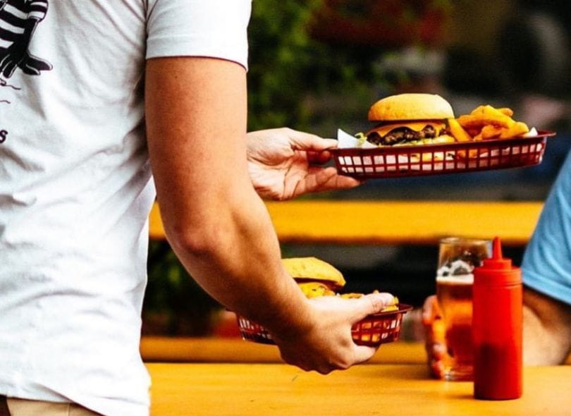 Food being served from Brave Brewing's menu.