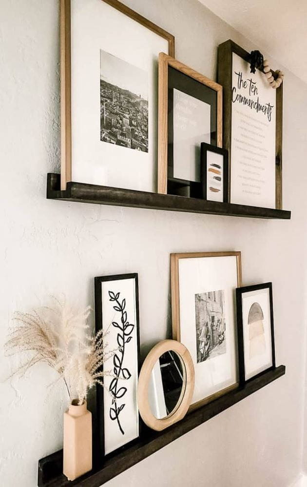 Black and white wall art on shelves.