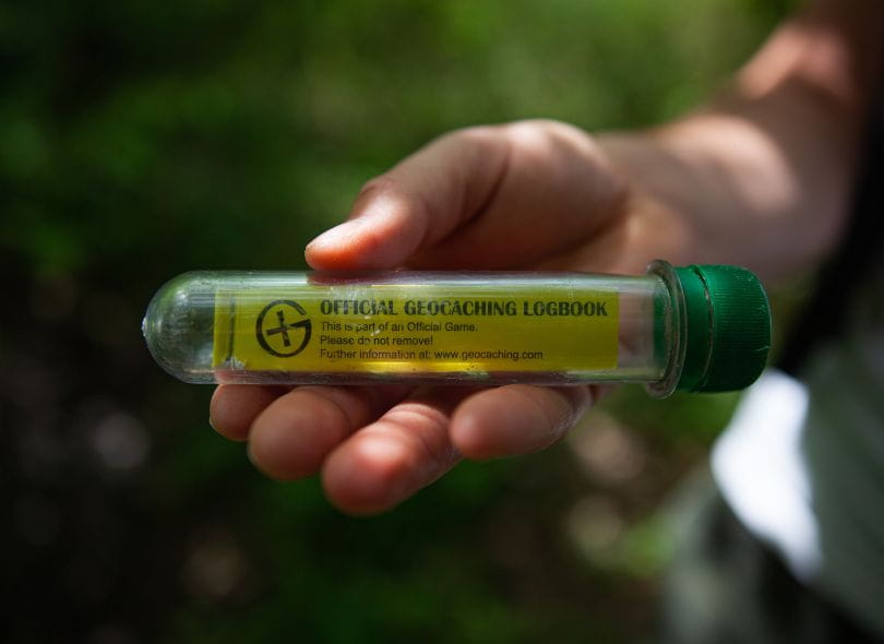 Official Geocaching logbook in a tube.