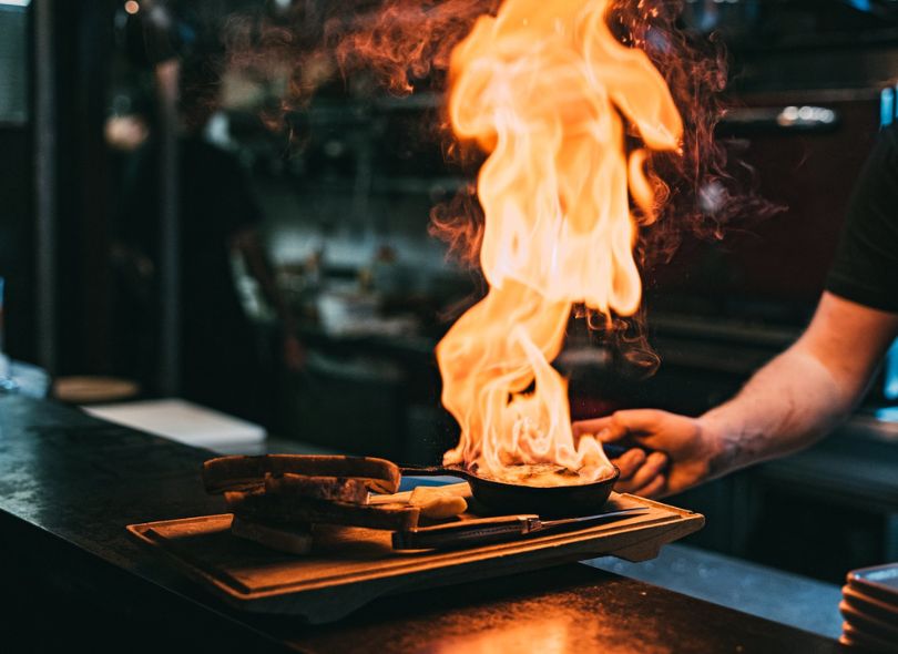 Flaming haloumi from Social Kitchen about to be served.