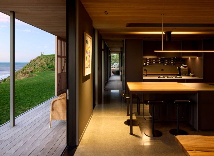 Stunning kitchen with gas stove top in Taranaki at night.