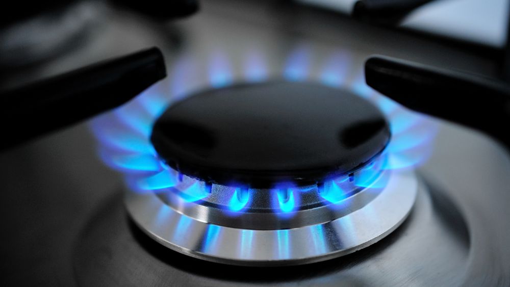 Flames on gas cooktop.