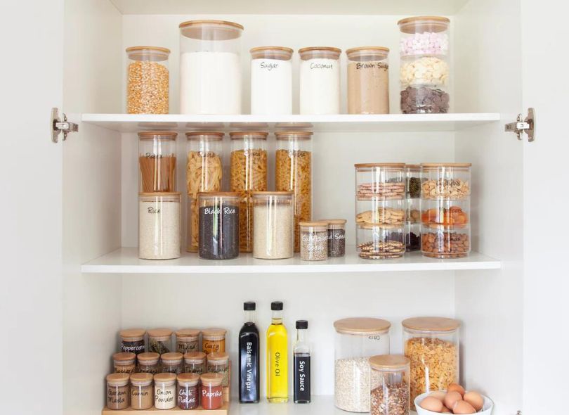 Organised pantry with labelled jars.