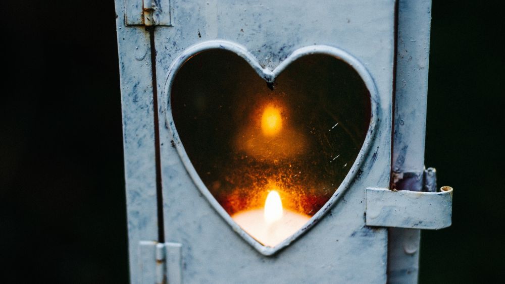 Candle in heart shaped holder.