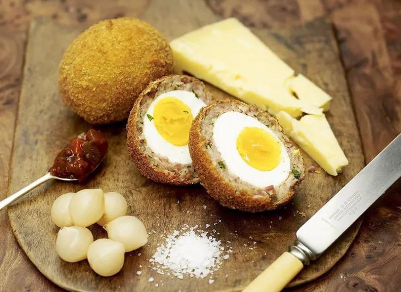 Jamie Oliver's proper scotch eggs served with pickle.