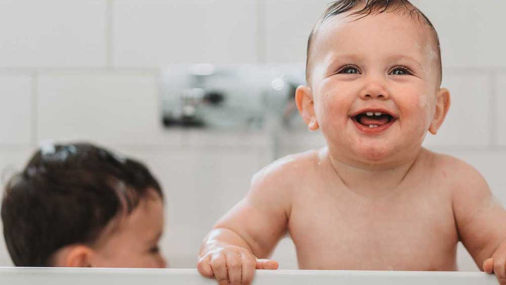 young child in bath