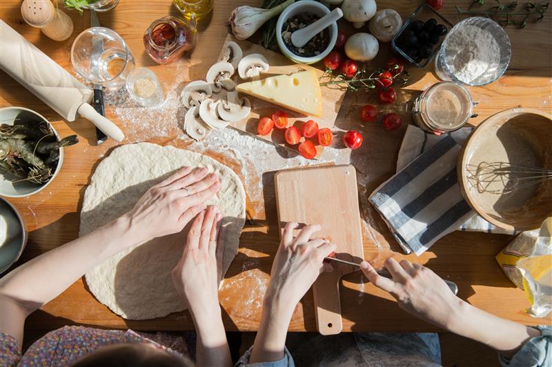people making pizza