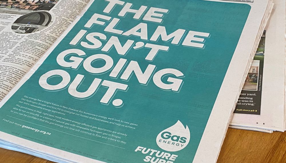 The flame isn't going out newspaper advertisement