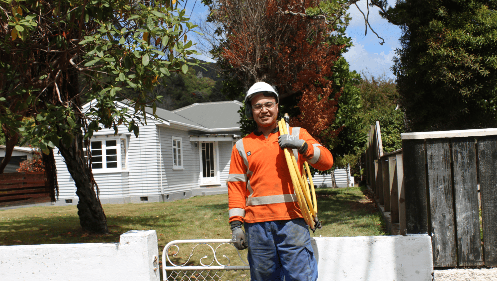 Worker connecting home to gas