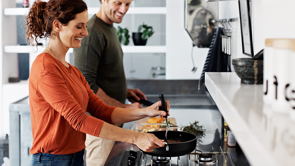 Couple cooking with gas